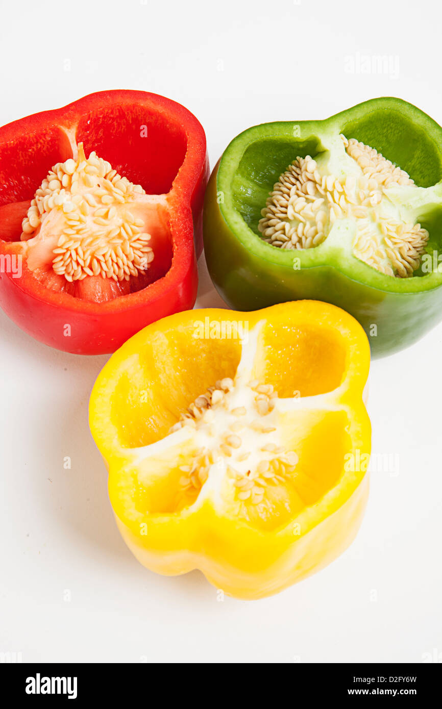 Cross section of different colored bell peppers Stock Photo Alamy