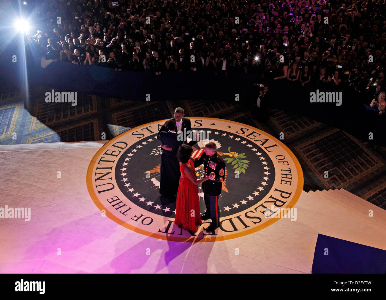 Washington DC, USA. 21st January 2013. United States President Barack Obama dances with Staff Sergeant Bria D. Nelson of the Air Force as first lady Michelle Obama dances with Gunnery Sergeant Timothy D. Easterling of the Marine Corps at the Commander-in-Chief's Inaugural Ball in Washington, at the Washington Convention Center during the 57th Presidential Inauguration Monday, Jan. 21, 2013. .Credit: Pablo Martinez Monsivais / Pool via CNP Stock Photo
