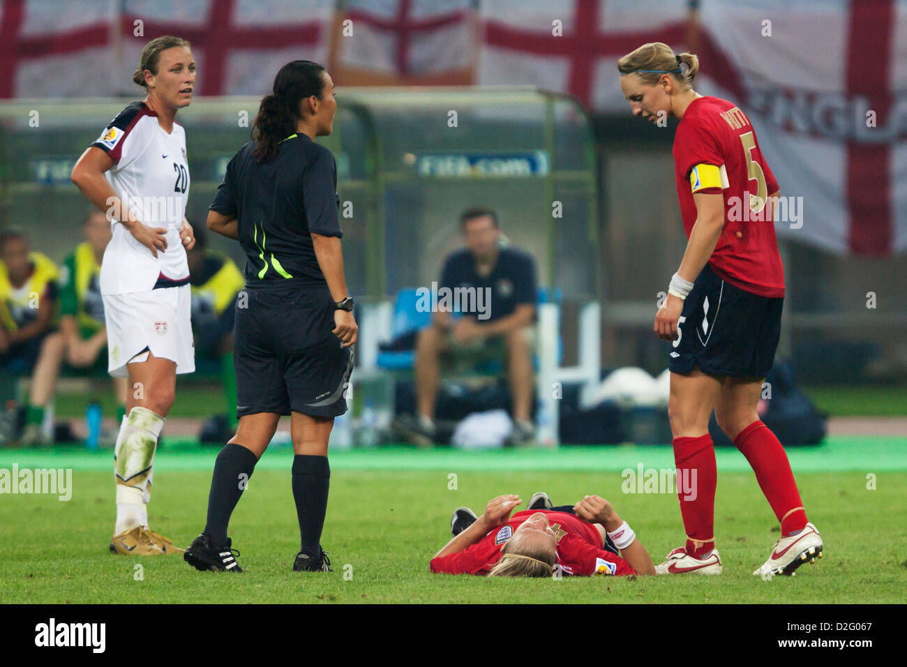 England team captain Faye White (5) checks on injured teammate Katie Chapman during a World Cup quarterfinal match v. the USA. Stock Photo