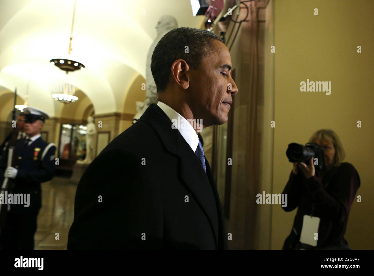 Washington DC, USA. 21st January 2013. United States President Barack Obama walks through the U.S. Capitol on his way to being sworn-in for a second term by Supreme Court Chief Justice John Roberts during his public inauguration ceremony at the U.S. Capitol Building in Washington, D.C. on January 21, 2013. President Obama was joined by First Lady Michelle Obama and daughters Sasha and Malia. .Credit: Molly Riley / Pool via CNP Stock Photo