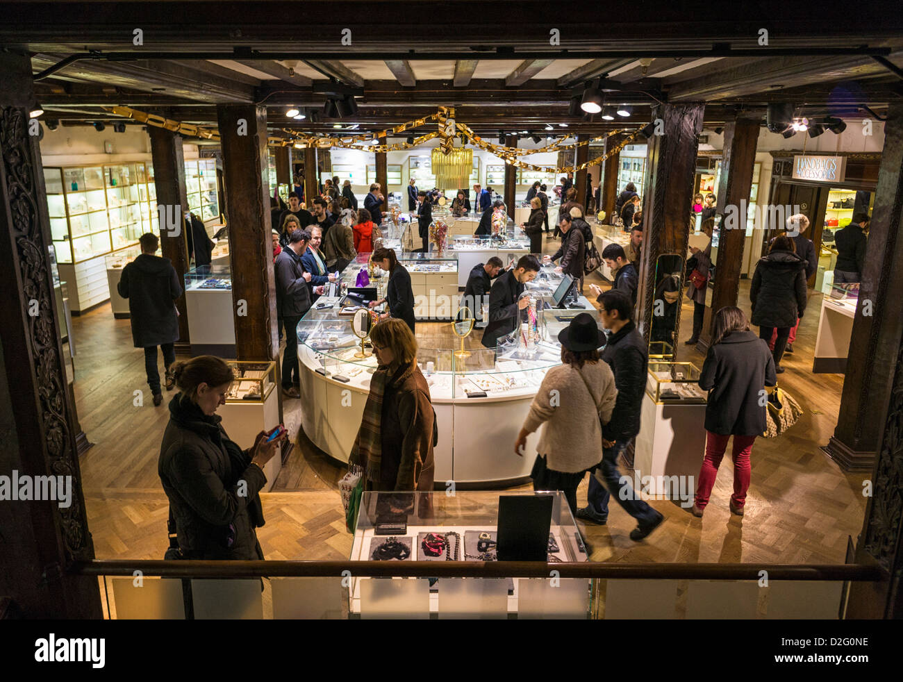 Liberty store, Regent Street, London, UK - lower ground floor with people shopping Stock Photo