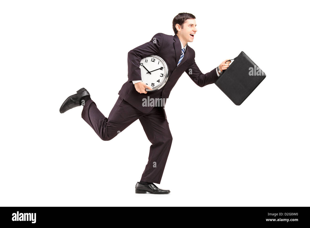 Full length portrait of a businessman running with clock and briefcase isolated on white background Stock Photo