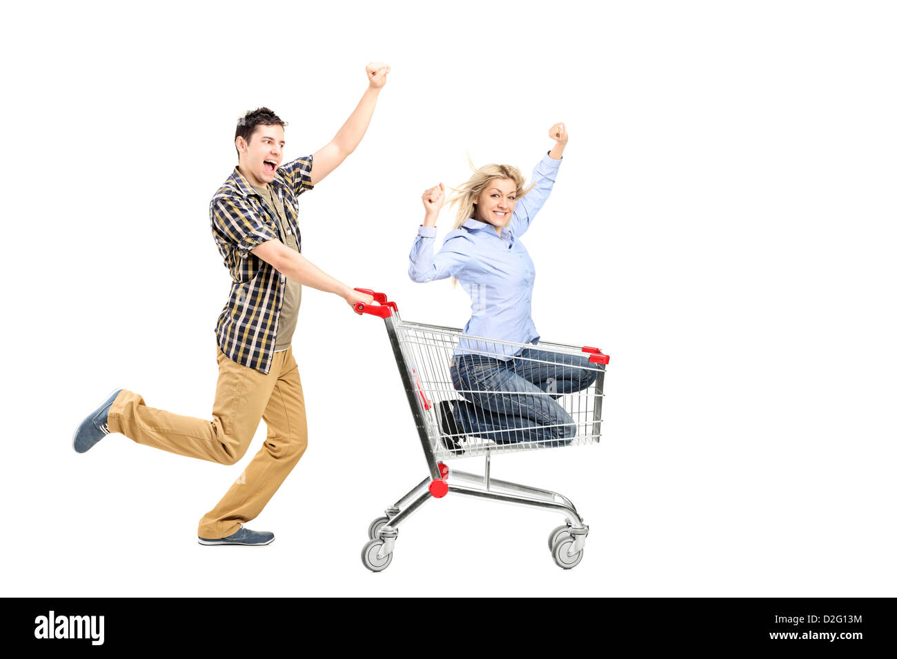 Full length portrait of a young man pushing a woman in a shopping cart ...