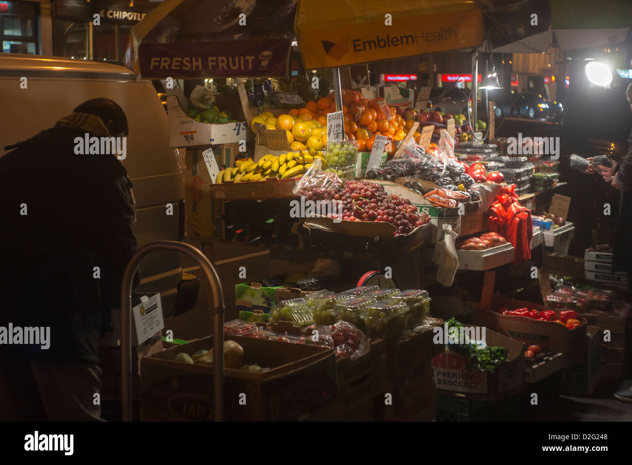 A 24 hour fruit and vegetable stand in the Chelsea neighborhood of New