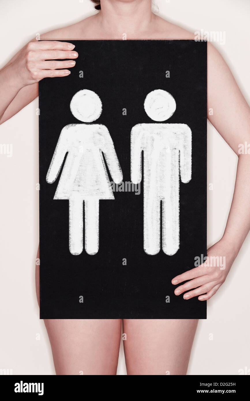 Woman holding a blackboard with male and female symbols - gender / reproduction / IVF / designer baby concept Stock Photo