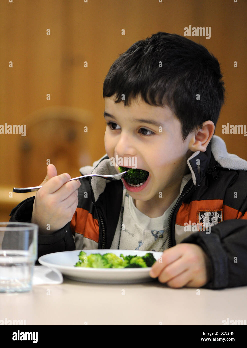 Kuersat Iltas eats broccoli at the Hospital for Paediatrics and Adolescent Medicine in Dortmund, Germany, 23 January 2013. The Research Institute for Child Nutrition presented a new children's menu for hospitals. Photo: Caroline Seidel Stock Photo