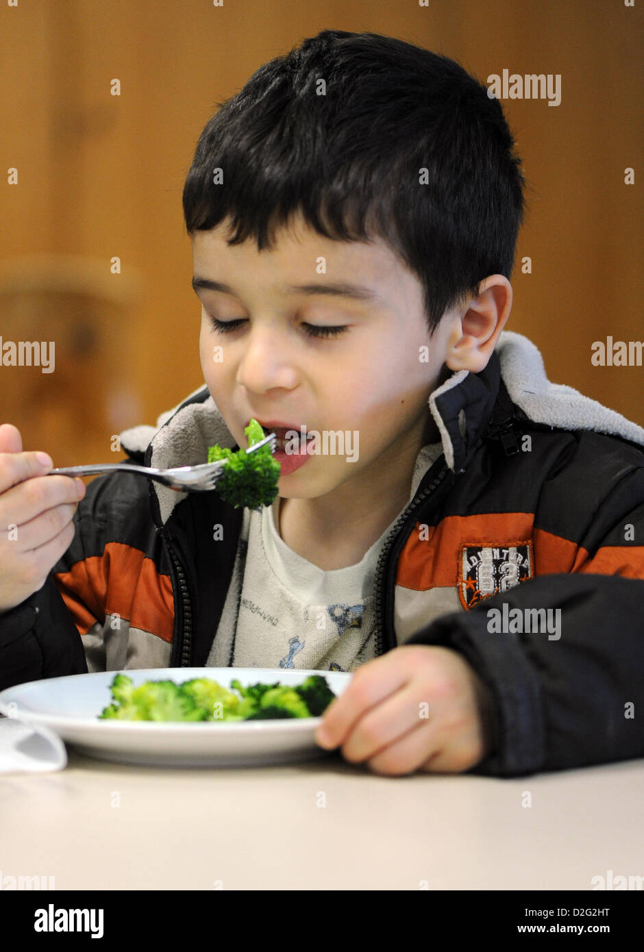 Kuersat Iltas eats broccoli at the Hospital for Paediatrics and Adolescent Medicine in Dortmund, Germany, 23 January 2013. The Research Institute for Child Nutrition presented a new children's menu for hospitals. Photo: Caroline Seidel Stock Photo