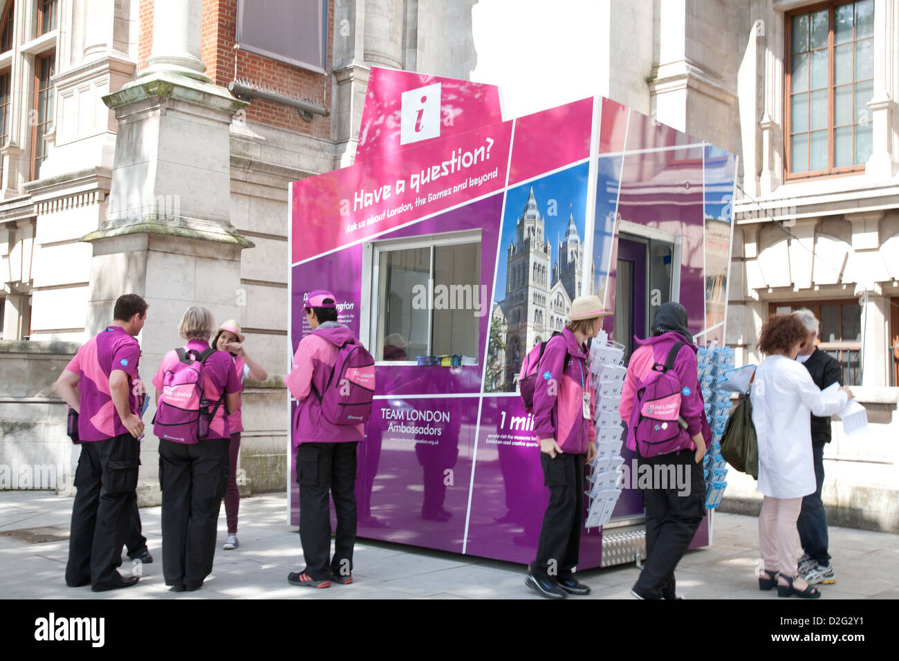 London 2012 Olympics gamesmakers standing at information stand, Old Brompton Road, Kensington, London, England, United Kingdom Stock Photo
