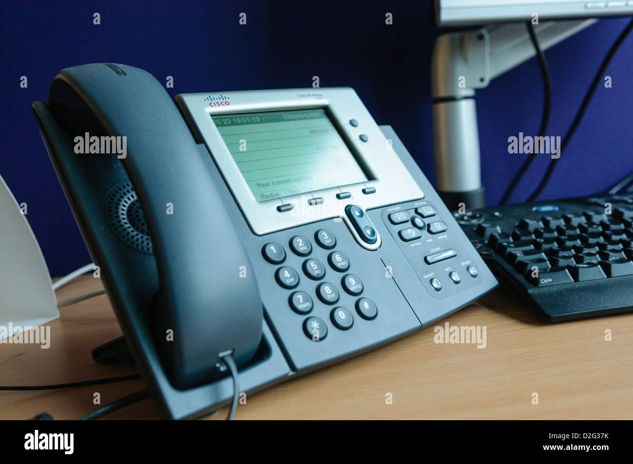 A Cisco IP telephone on an office desk Stock Photo