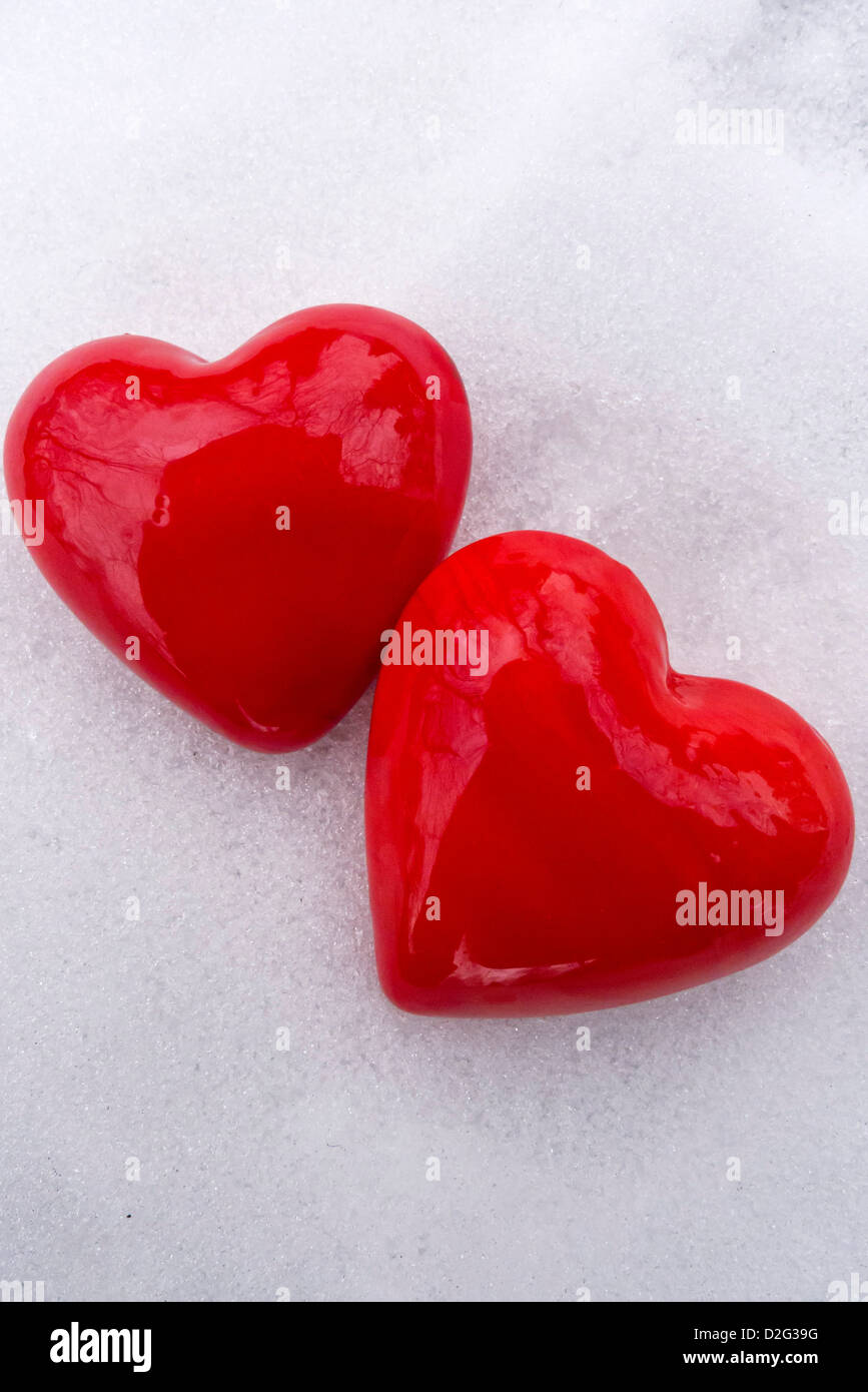 two valentine hearts shapes in the snow, love concept Stock Photo