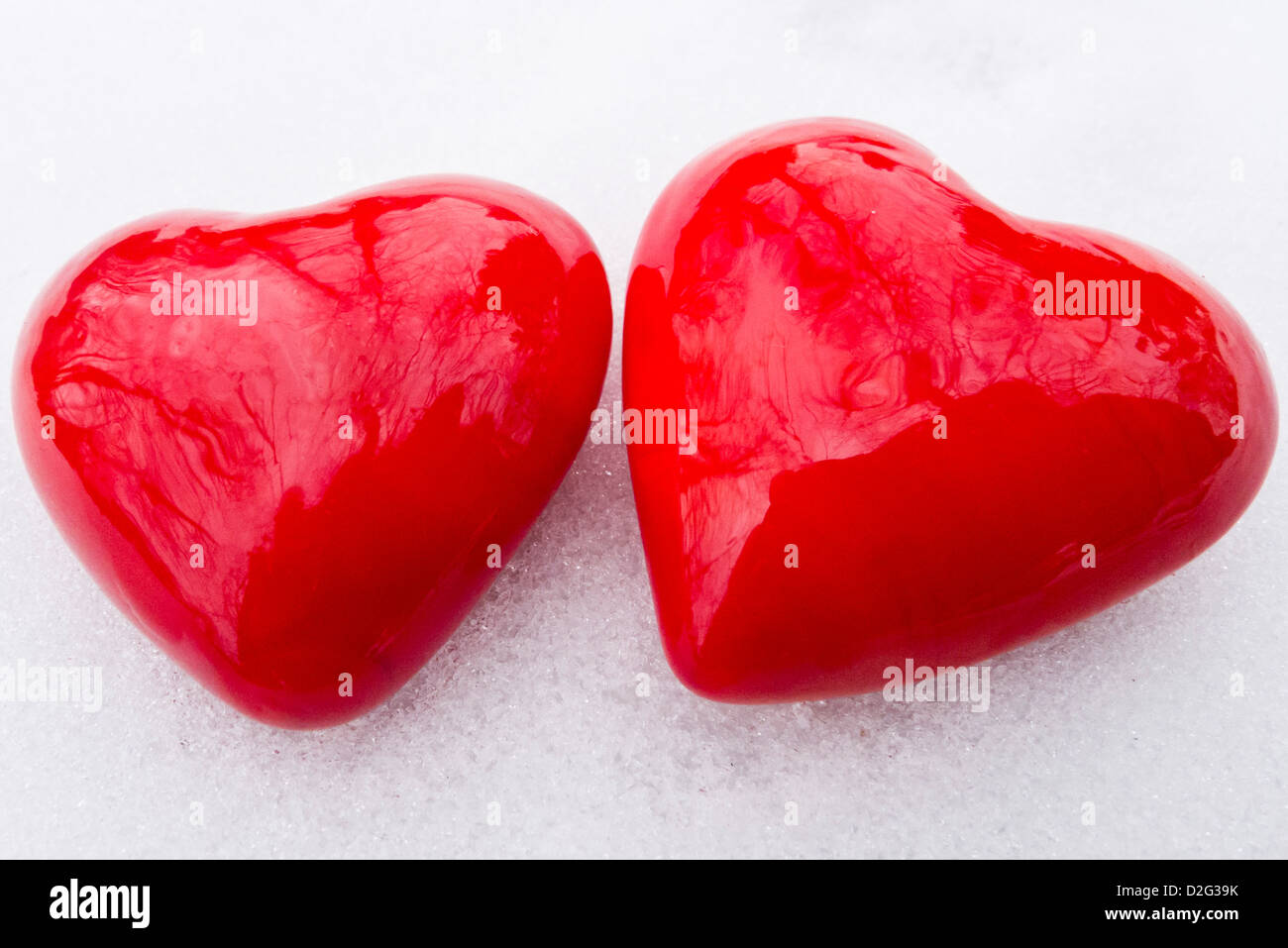 two valentine hearts shapes in the snow, love concept Stock Photo