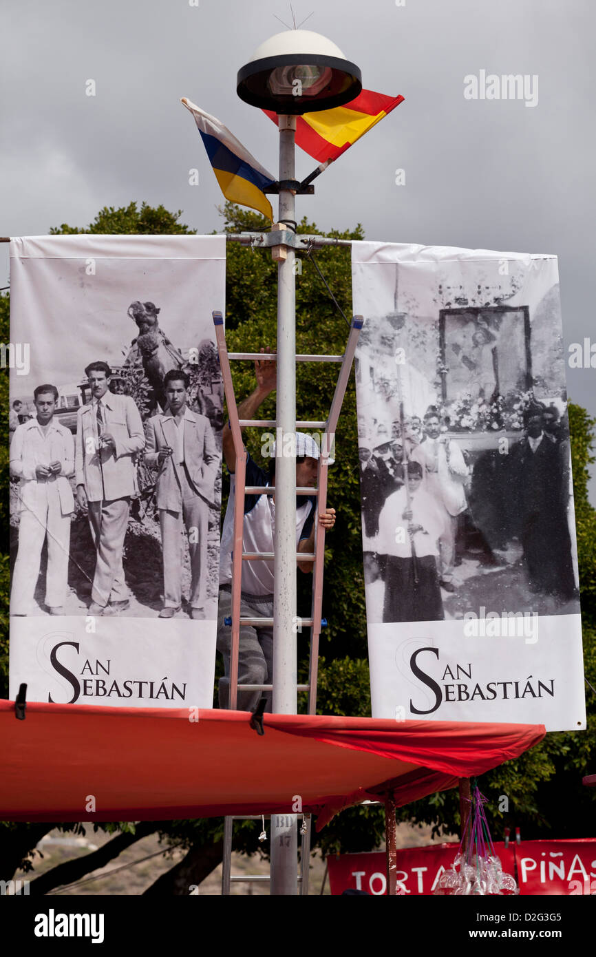Banners with old photos of the Fiesta of San Sebastian where local Adejeros bring their animals to be blessed Stock Photo