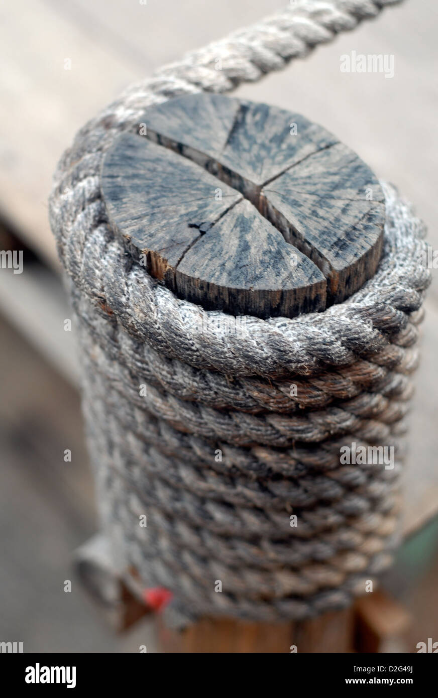 coiled rope on a mooring post in one the jetty at ban bang bao Stock Photo
