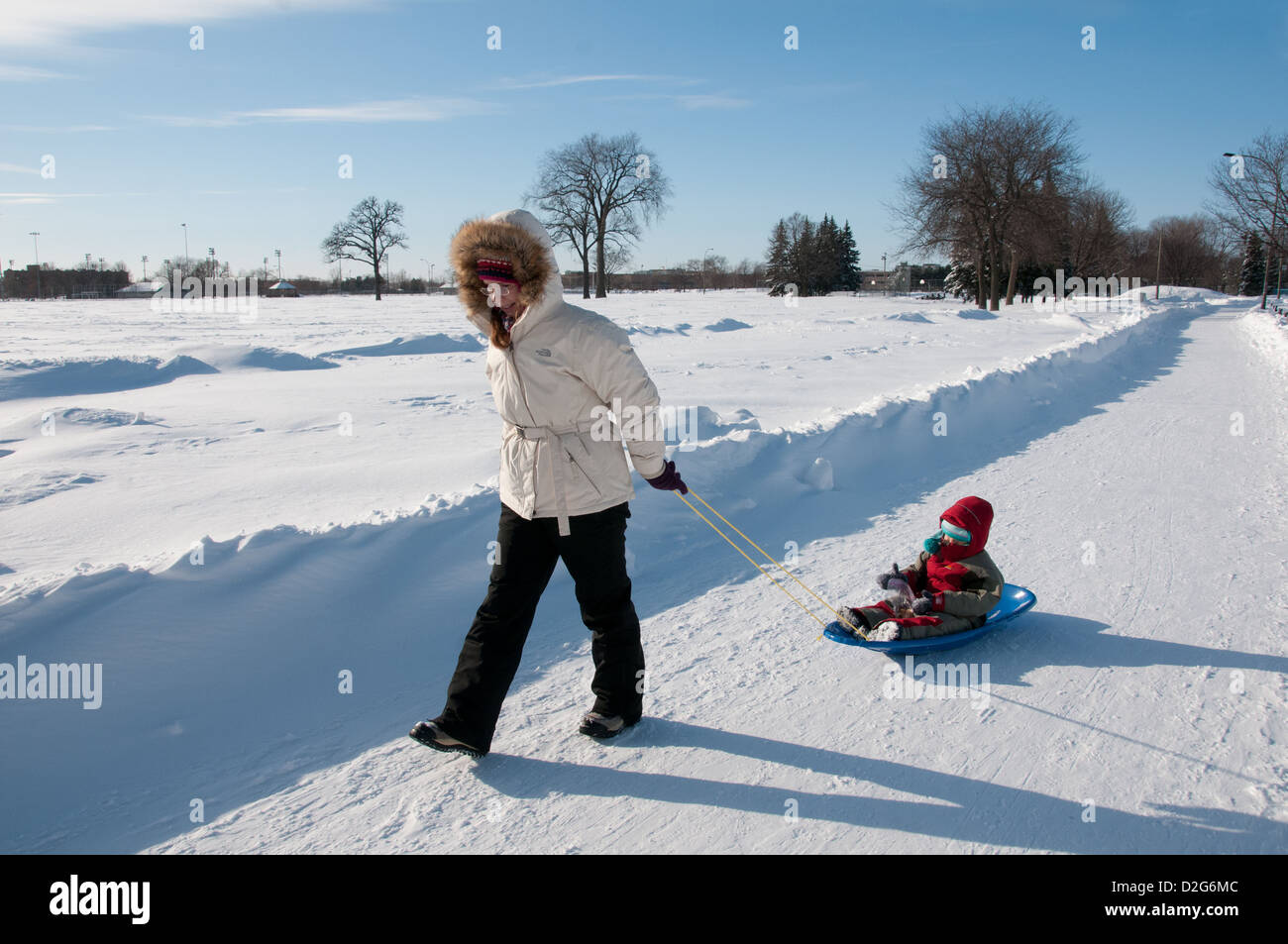 Mother and daughter Jarry Park winter Montreal Quebec Canada Stock
