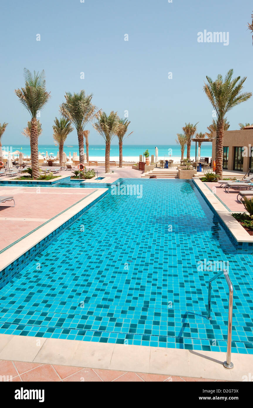 Swimming pool at the beach of luxury hotel, Saadiyat island, Abu Dhabi, UAE Stock Photo