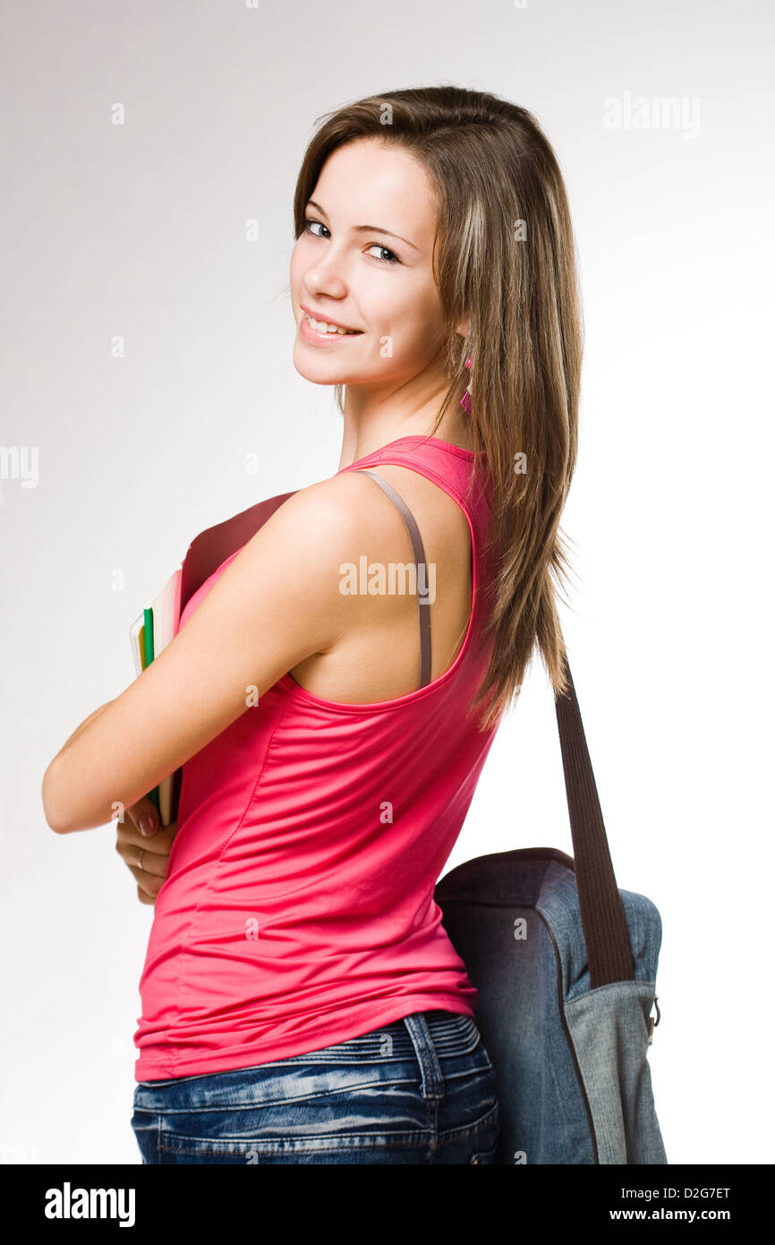 Pretty young student girl with colorful exercise books Stock Photo - Alamy