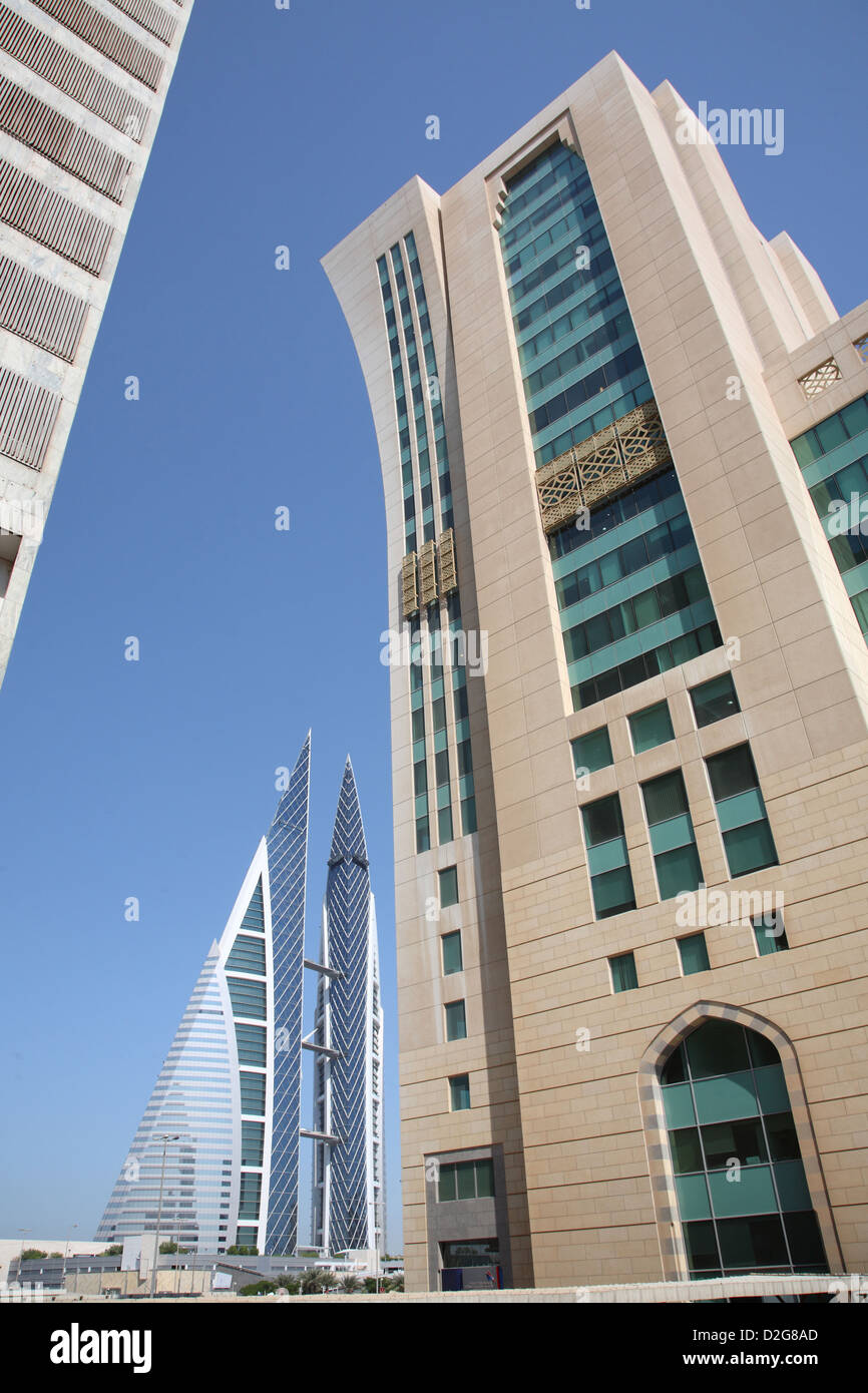 A tower block designed in Islamic style in Manama, capital of Bahrain. Bahrain World Trade Centre in the background. Stock Photo