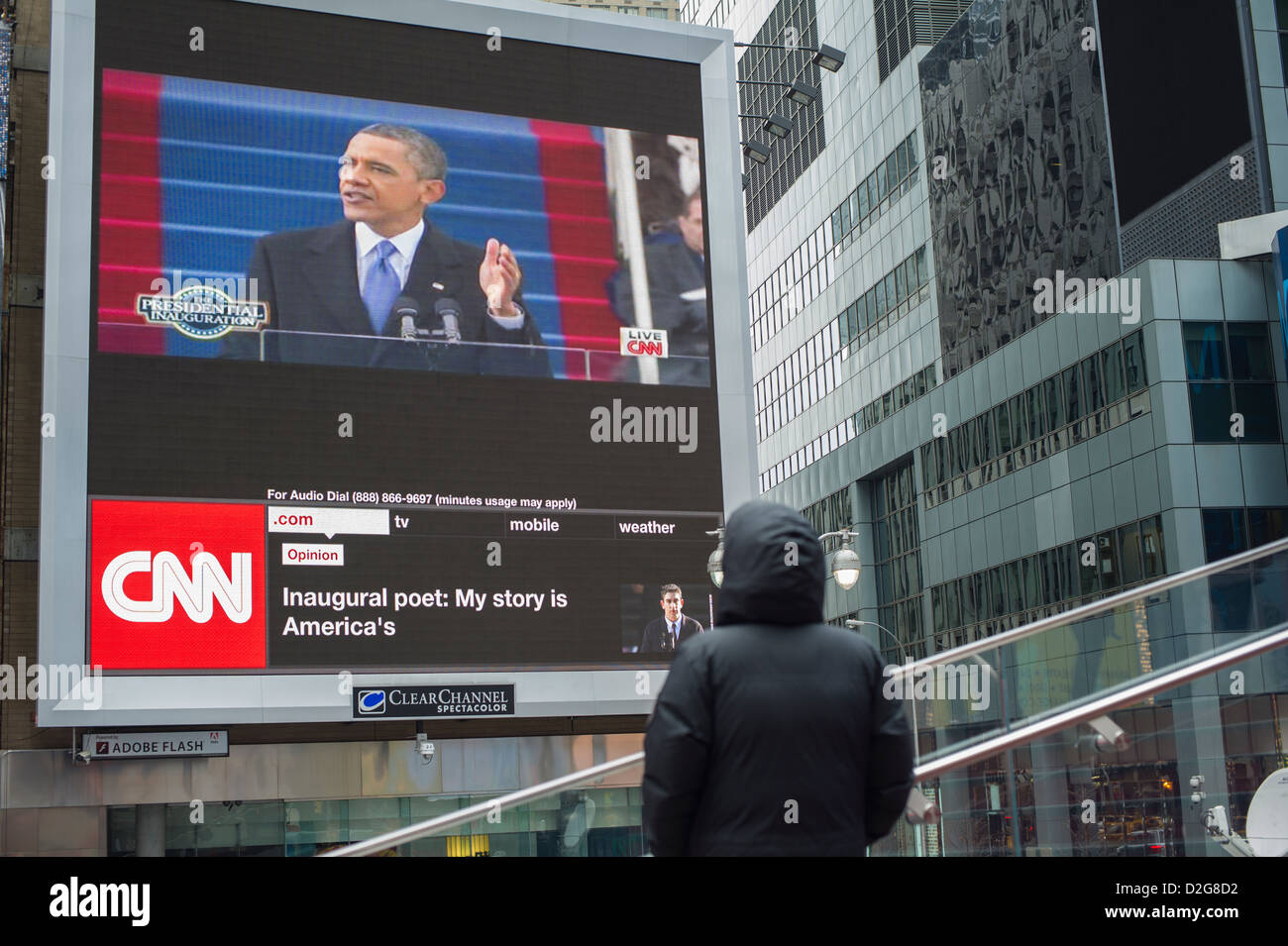 Passer-by gather in Times Square in New York on Monday, January 21, 2013 to watch the inauguration of Barack Obama Stock Photo