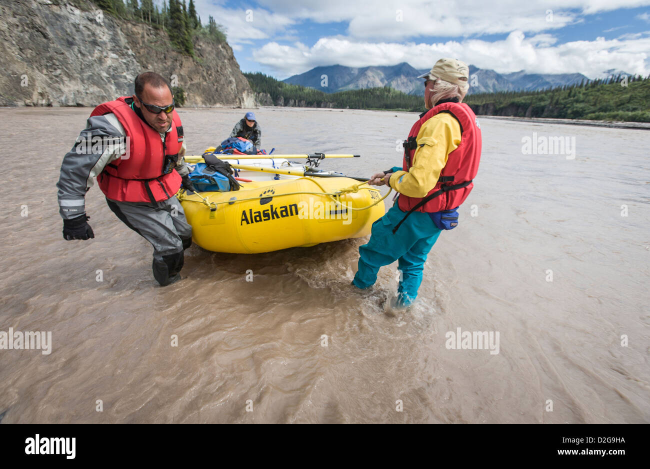 Dragging raft in shallow water along the Jacksina river, Wrangell-St ...