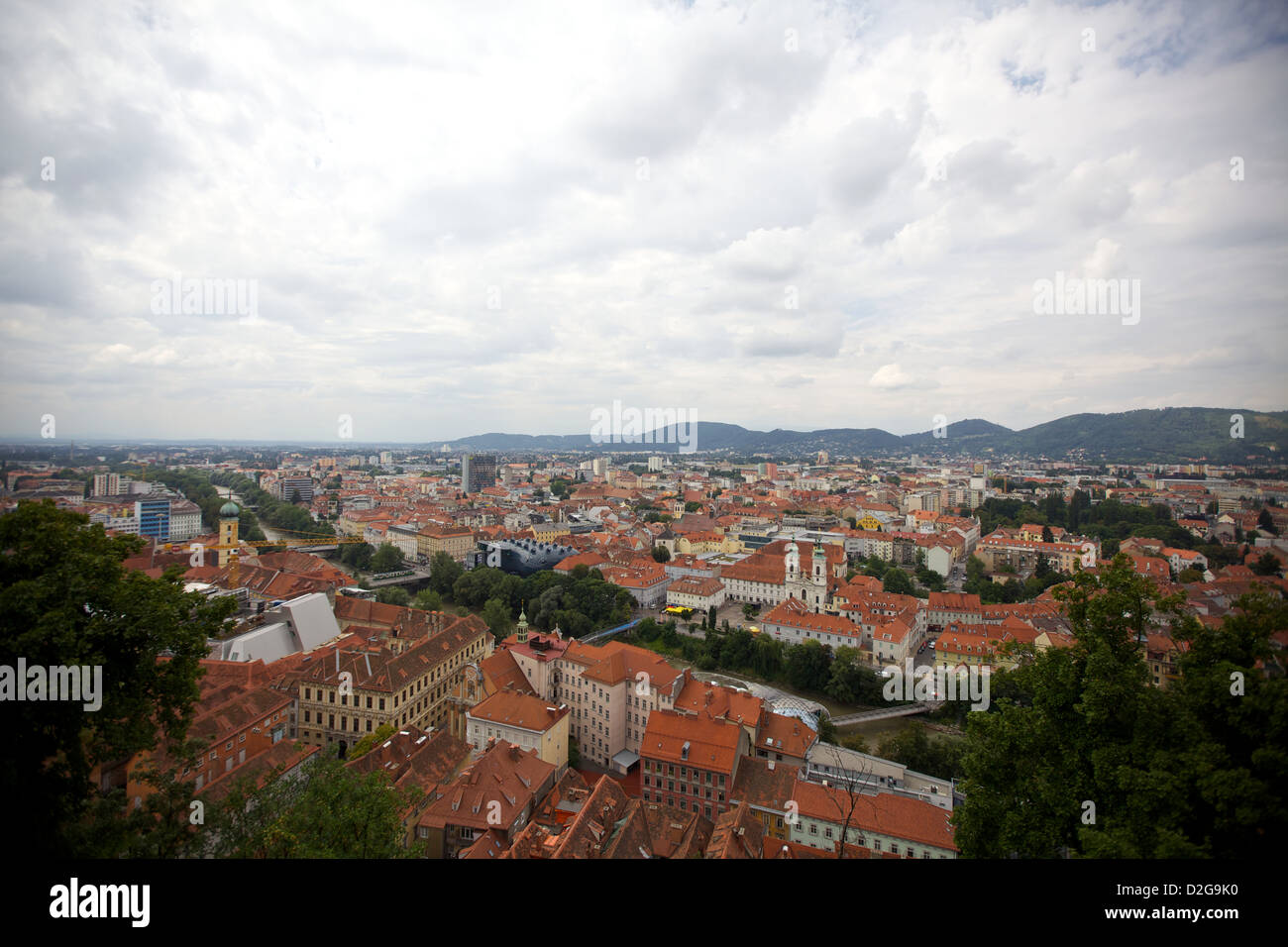 The city of Graz, Austria spreads out below a cover of clouds Stock Photo