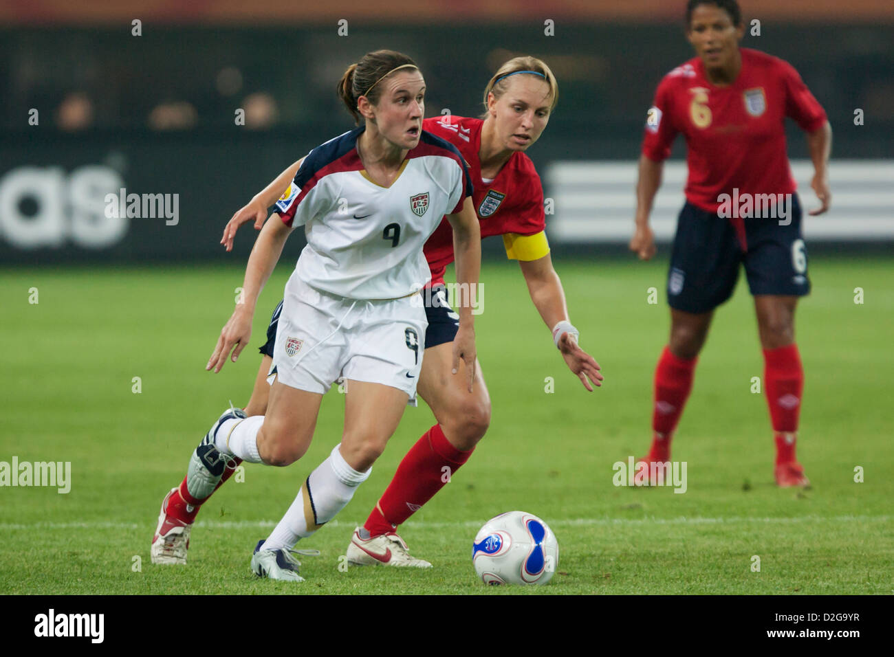 Heather O'Reilly of the USA (L) looks for space against Faye White of England (R) during a FIFA Women's World Cup match. Stock Photo