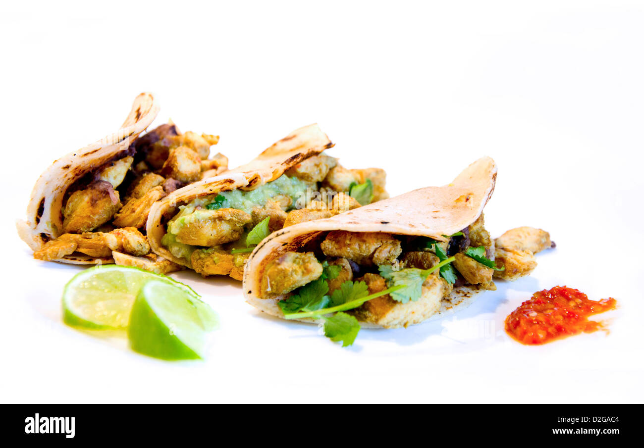 Three mexican tacos with chicken and lime Stock Photo