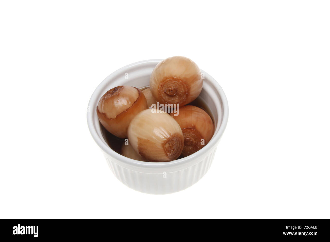 Pickled onions in a ramekin isolated against white Stock Photo