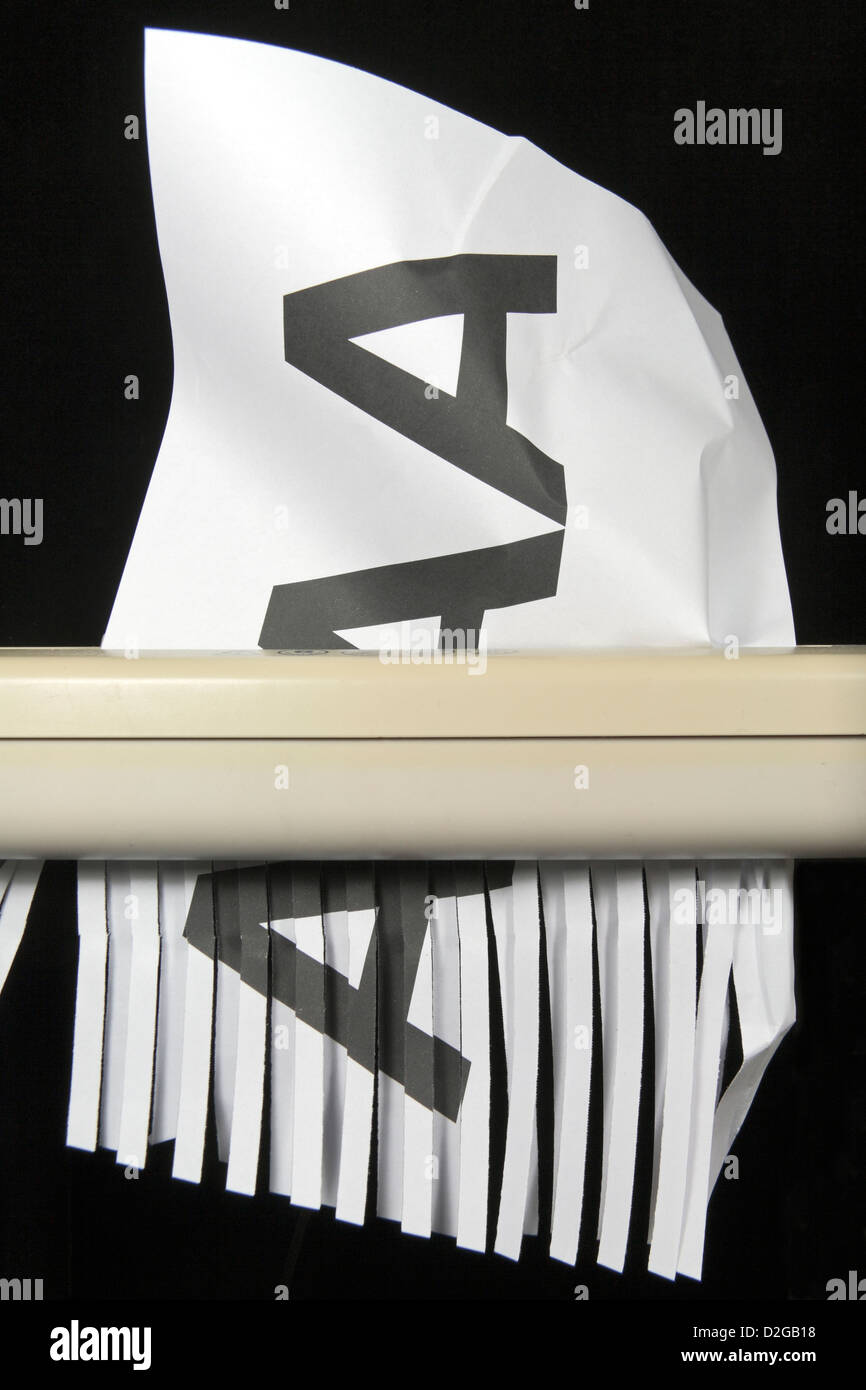 A printed AAA on A4 paper being shredded, symbolising a downgrading from the top rating of AAA. Stock Photo