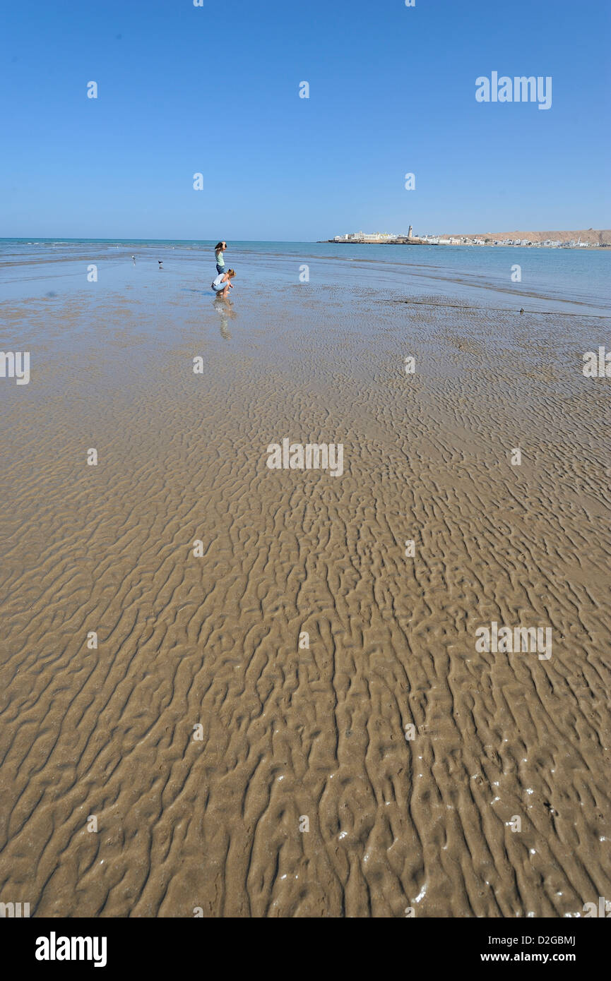 The beach at low tide with the village of Ayjah in the background; Sur;  Sharqyia, Oman Stock Photo - Alamy