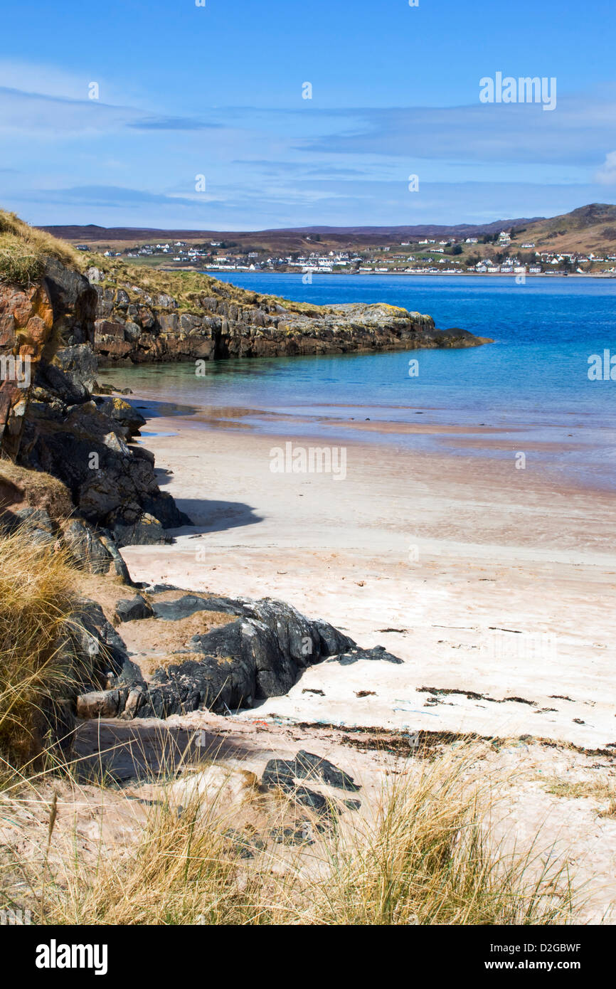 The sandy beach at Gairloch, Wester Ross, Scotland on a bright sunny, spring day showing blue sky and a beautiful turquoise sea Stock Photo