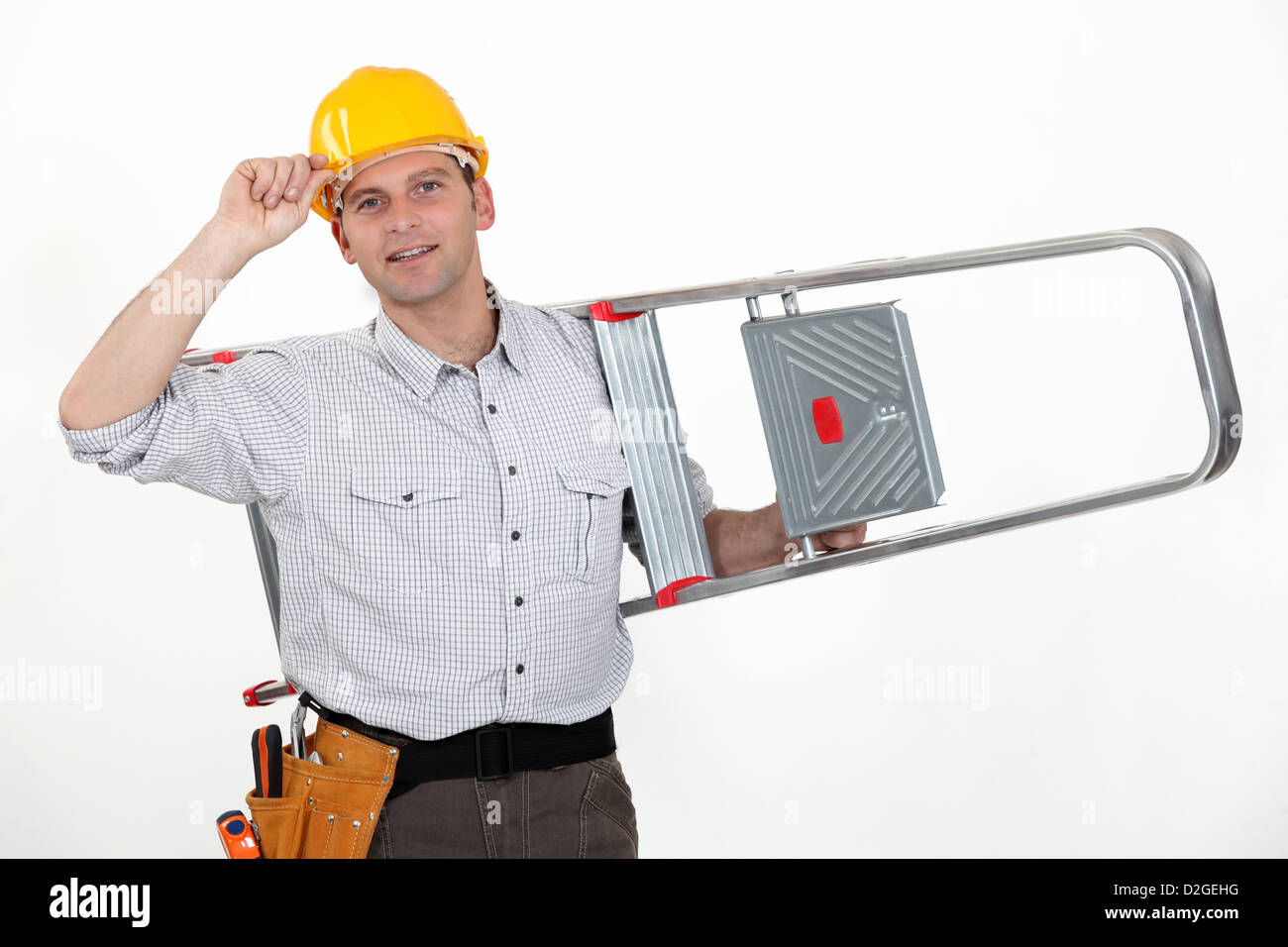 Builder carrying ladder Stock Photo