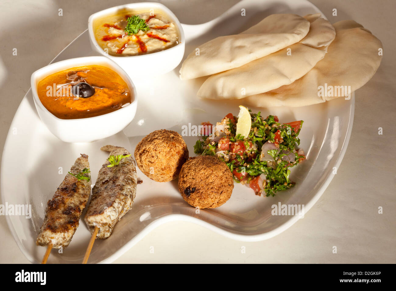 kebab platter with pita bread, meat ball, grilled chicken, hummus and