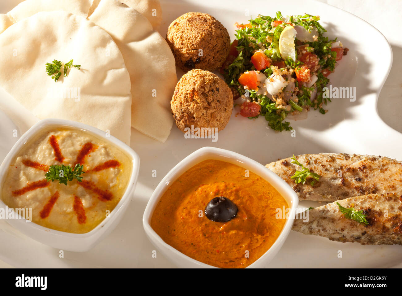 kebab platter with pita bread, meat ball, grilled chicken, hummus and salad. Stock Photo