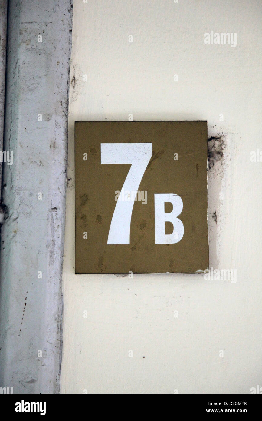 It's a photo of a Wall Sign that indicate area or room 7b. It's an indication in an old museum of Ho Chi Min City Stock Photo