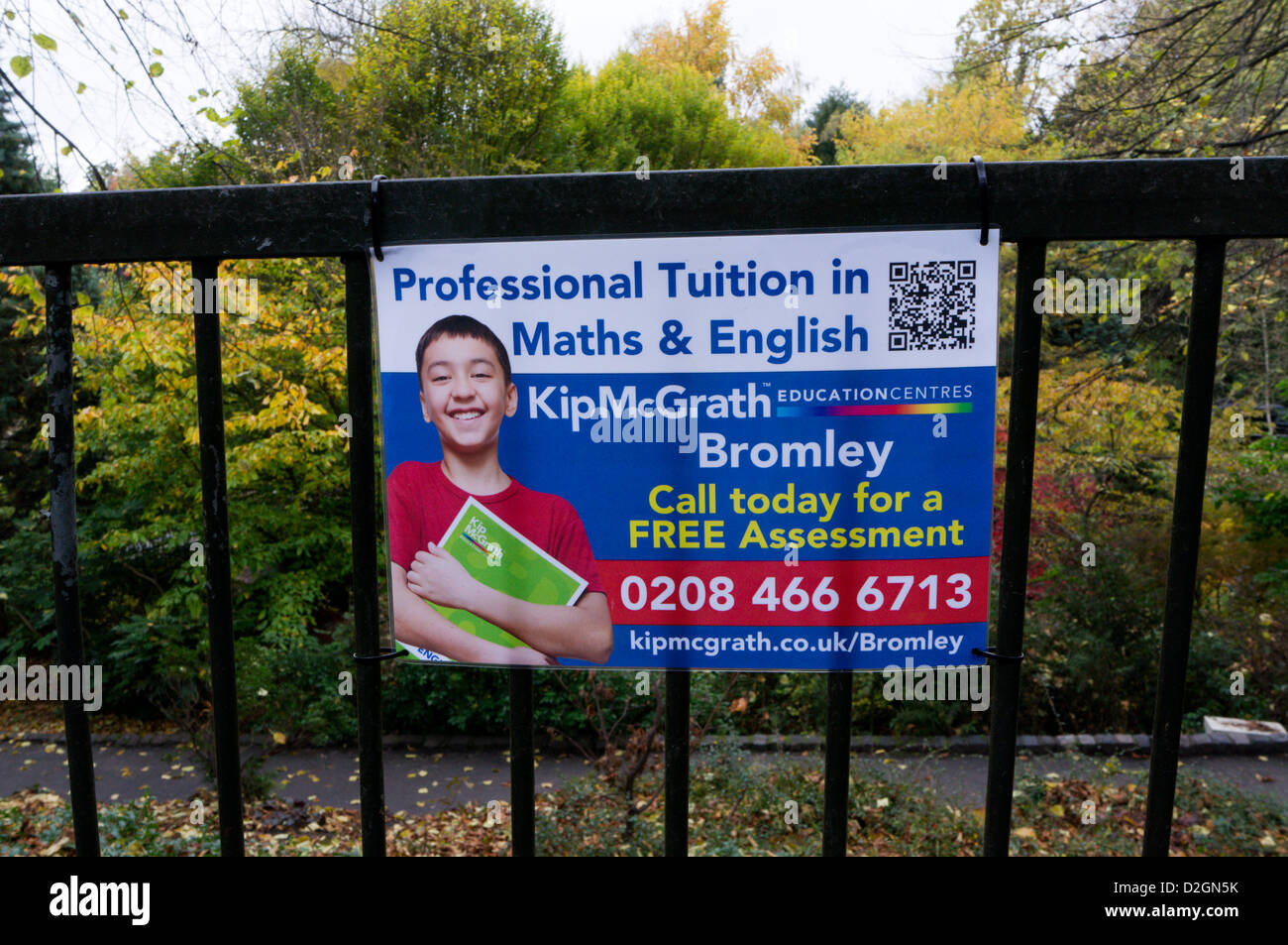 A sign for Kip McGrath Professional Tuition in Maths & English, containing a QR code which can be scanned for more details. Stock Photo