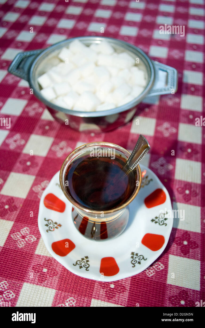 Turkish tea or çay, pronounced 'chai' traditionally served in a small tulip-shaped glasses without milk. Stock Photo