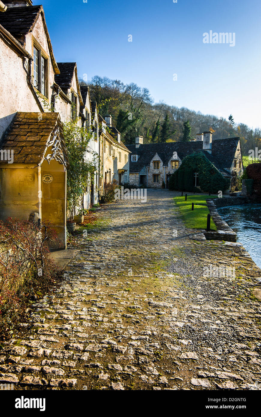 Cobblestones and cottages in Castle Combe Wiltshire England UK EU Stock Photo