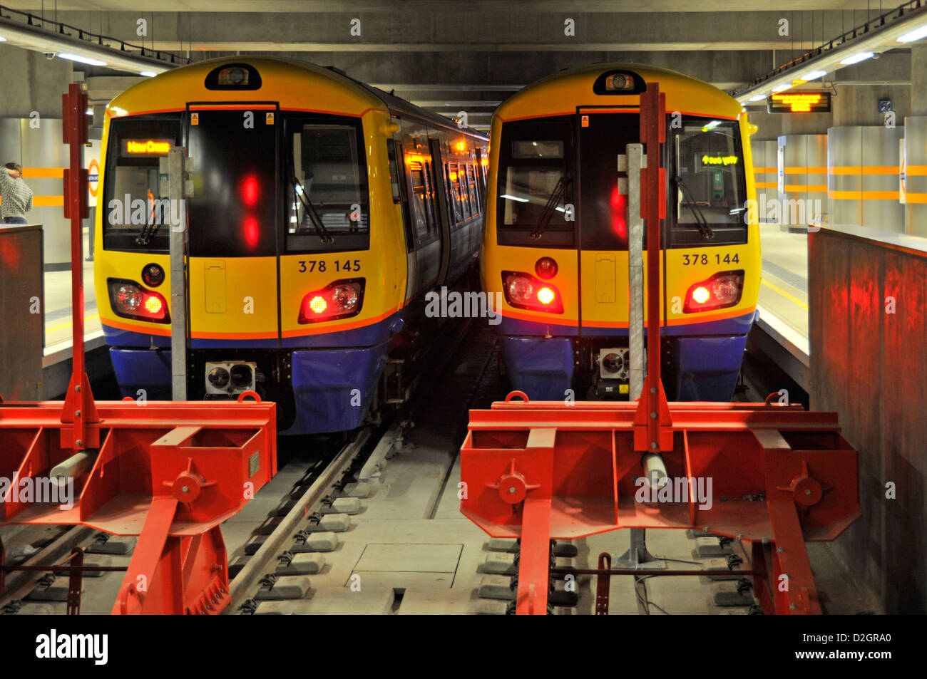 Two of a kind overground trains at terminal station buffers Dalston Junction station London England UK Stock Photo