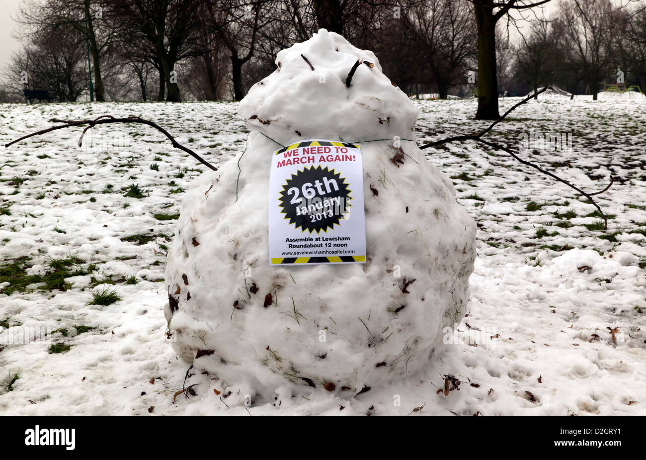 A snowman advertising the protest march to help save Lewisham Hospital in the latest round of Government NHS cuts. Stock Photo