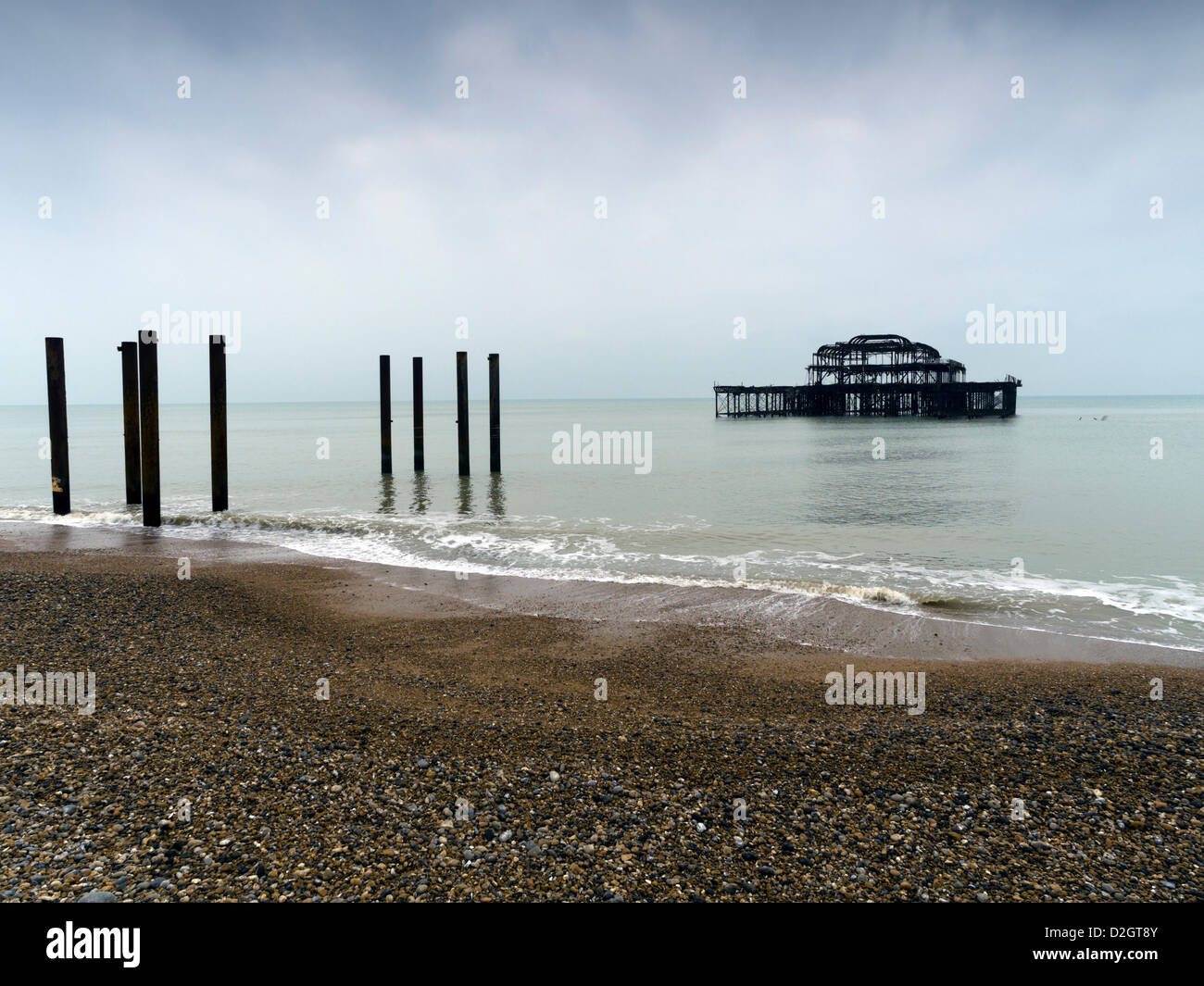 Brighton, UK, 24th January, 2013. Parts of the derelict West Pier in Brighton have again collapsed into the sea after the wintry weather took its toll at the weekend. The pier, ravaged by fire in 2003 and battered by storms, was closed to the public in 1975. The West Pier Trust, owners of the structure, said: 'Thanks to the advanced Edwardian engineering of the pier, it has withstood decades of storms with minimal damage occurring. However, it is still very sad to witness when parts are lost.' The pier was built in 1866 by Eugenius Birch. Stock Photo