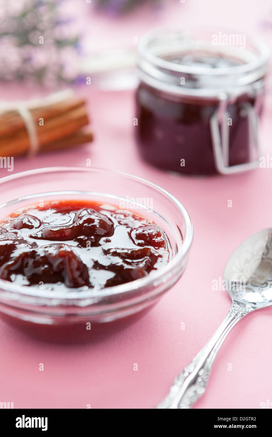 Plum jam in glass jar, close up Stock Photo