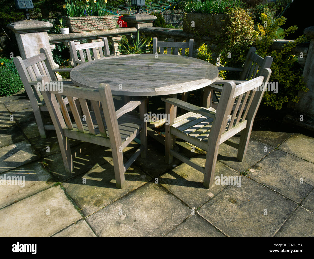 Wooden Garden Table & Chairs On Patio Stock Photo - Alamy