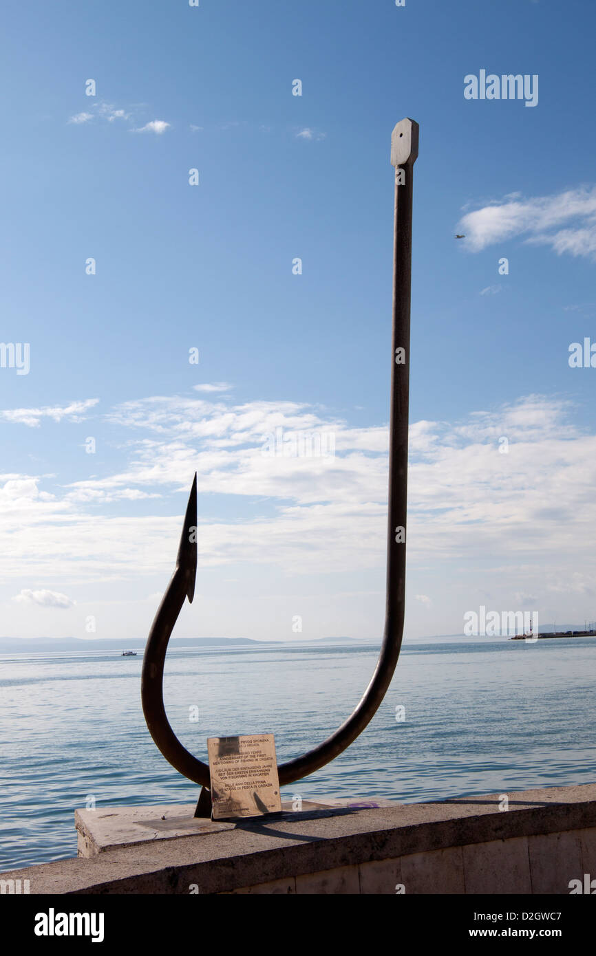An old fishing hook attached as memorial in the harbor of Split