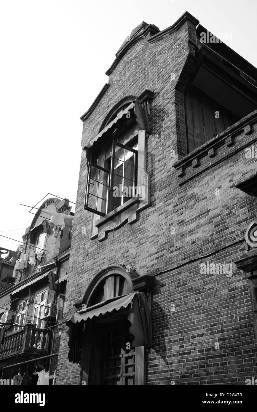 Old Shanghai street building of local residence home made of stone and brick in black and white, China. Stock Photo