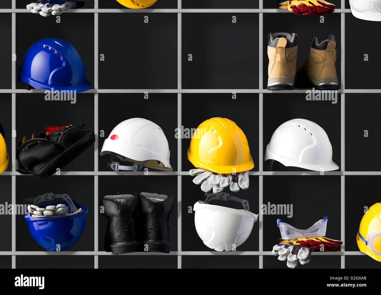 Different coloured safety hard hats on shelves with boots and tool belt