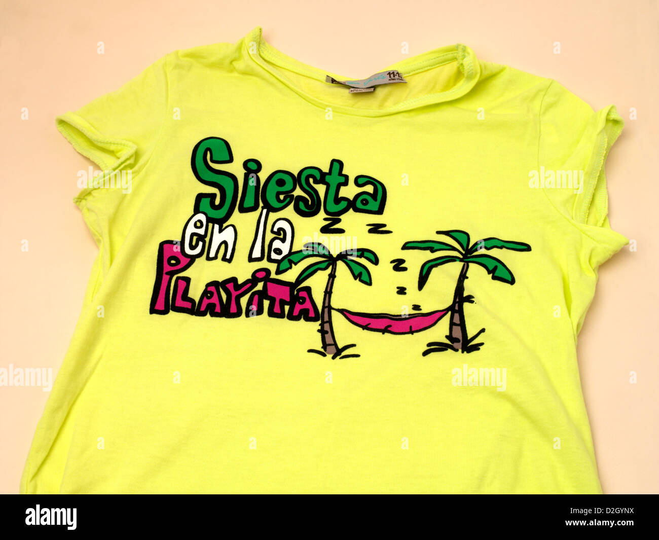 Funky Tee Shirt Siesta en la Playita Sleeping on the Beach Spanish Souvenir Stock Photo