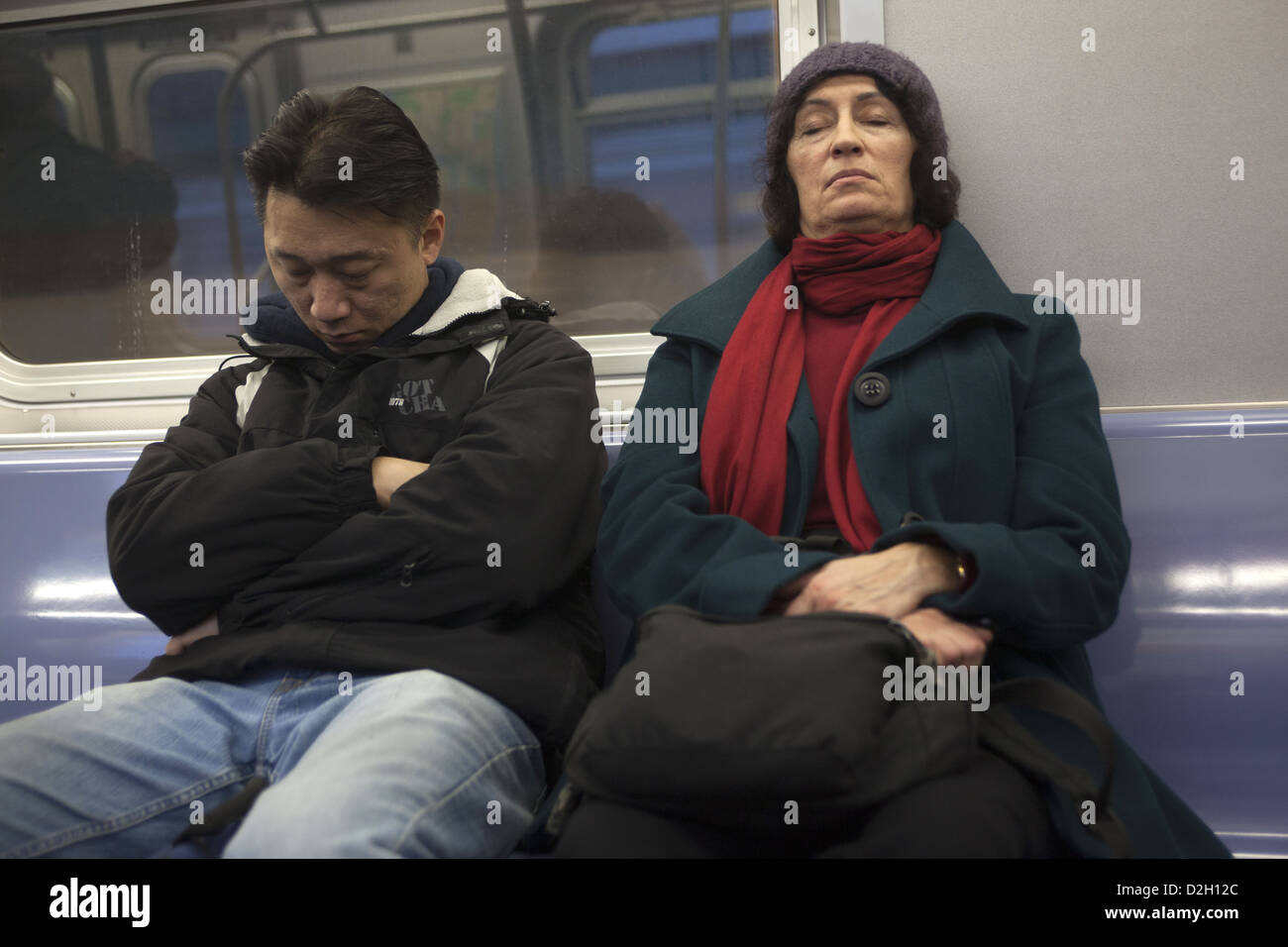 Two tired subway riders, New York City. Stock Photo