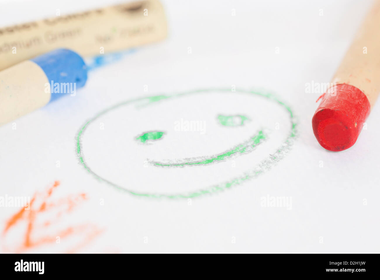 Crayons and paper with elementary drawing Stock Photo Alamy