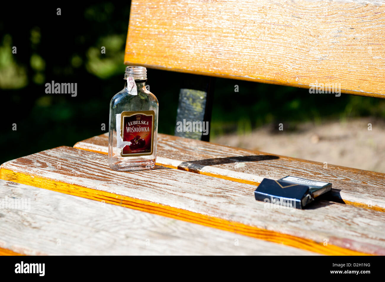 Empty bottle of vodka and box of cigarettes Stock Photo Alamy