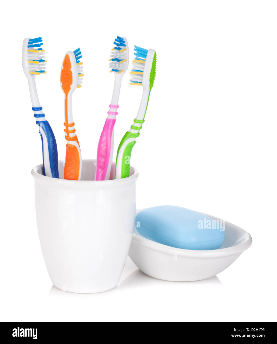 Four colorful toothbrushes and soap. Isolated on white background Stock ...